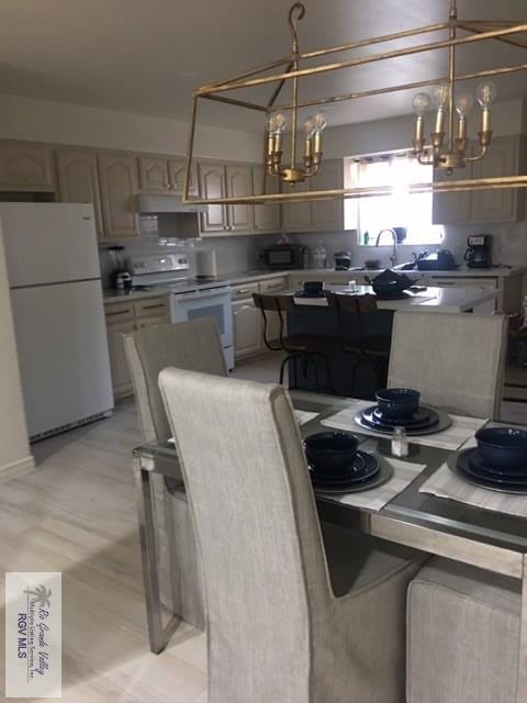 2765 N Coria St Unit 18, Brownsville, TX 78520 - dining space featuring a chandelier