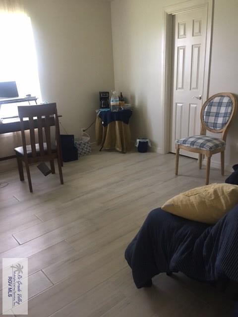 2765 N Coria St Unit 18, Brownsville, TX 78520 - living area featuring wood finished floors