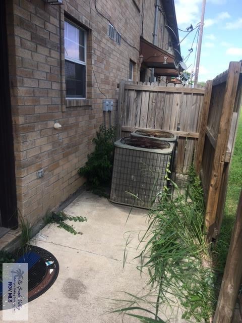 2765 N Coria St Unit 18, Brownsville, TX 78520 - exterior space featuring central AC unit and fence