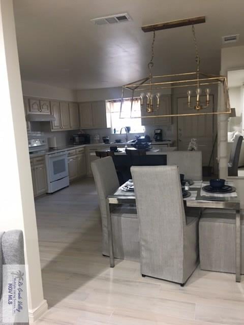 2765 N Coria St Unit 18, Brownsville, TX 78520 - dining space with light wood finished floors and visible vents