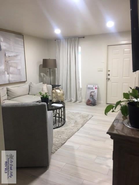 2765 N Coria St Unit 18, Brownsville, TX 78520 - living room featuring wood finished floors and recessed lighting