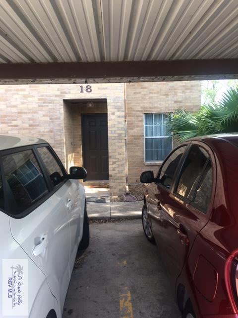 2765 N Coria St Unit 18, Brownsville, TX 78520 - view of exterior entry with brick siding