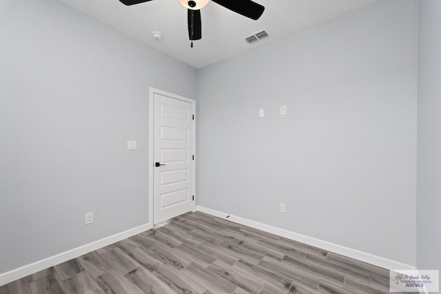 2023 Peace Dr # 23, La Feria, TX 78559 - spare room with ceiling fan, wood finished floors, baseboards, and a smoke detector