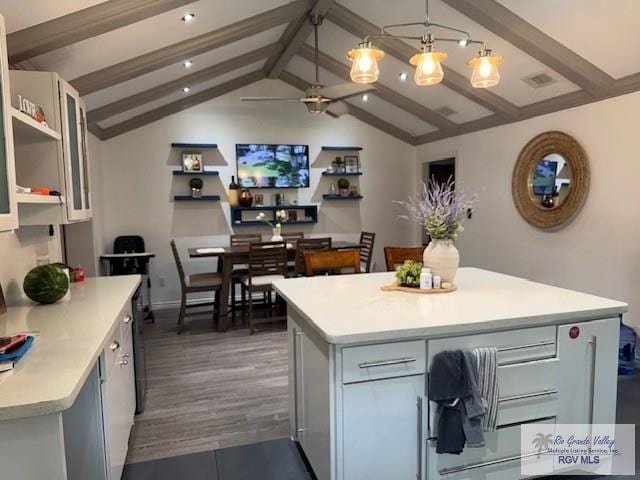 1875 Sancho Panza Cir, Brownsville, TX 78521 - kitchen with light countertops, a center island, ceiling fan, pendant lighting, and baseboards