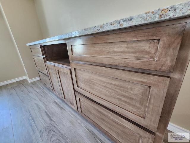 details with wood finished floors and baseboards