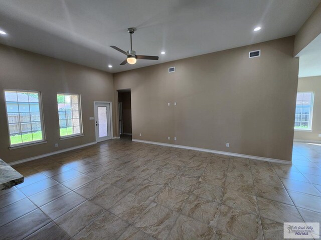 unfurnished living room with visible vents, recessed lighting, baseboards, and ceiling fan