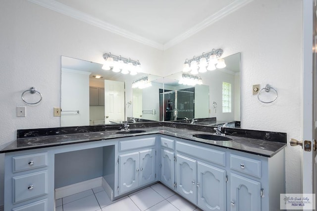 bathroom featuring crown molding, tile patterned flooring, vanity, and a shower with shower door