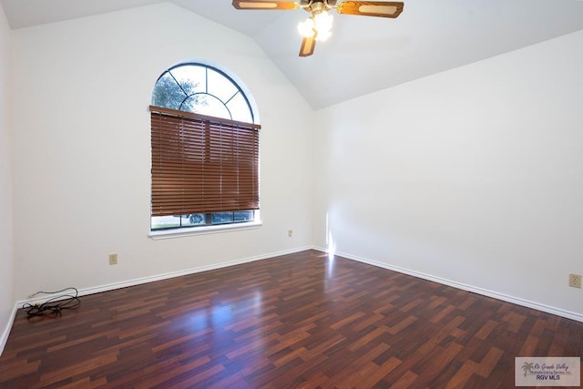 empty room featuring ceiling fan, dark wood-type flooring, and lofted ceiling