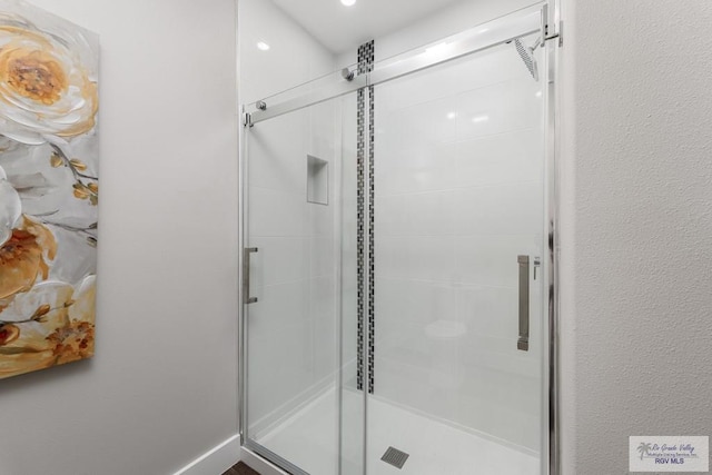 bathroom with an enclosed shower