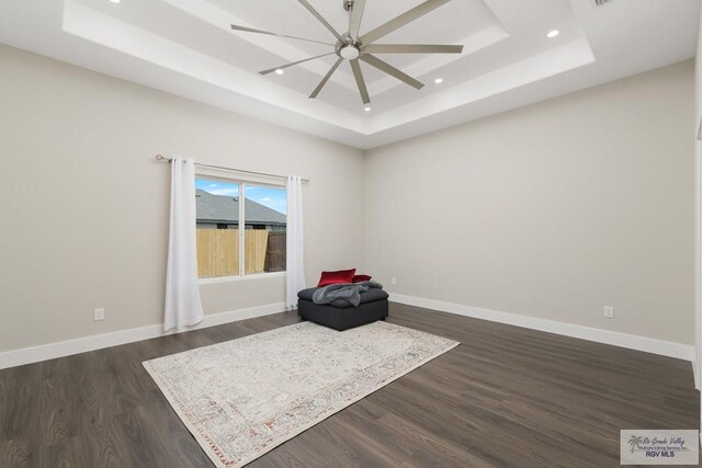 6121 Guadalupe River St, Brownsville, TX 78521 - unfurnished room featuring a raised ceiling, ceiling fan, dark wood-style flooring, recessed lighting, and baseboards