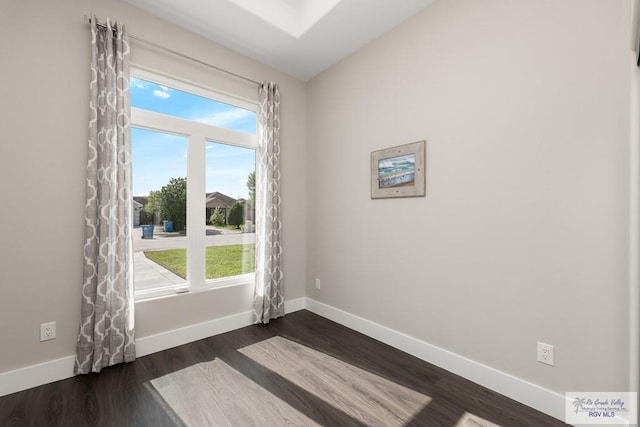 6121 Guadalupe River St, Brownsville, TX 78521 - spare room with dark wood-style flooring and baseboards