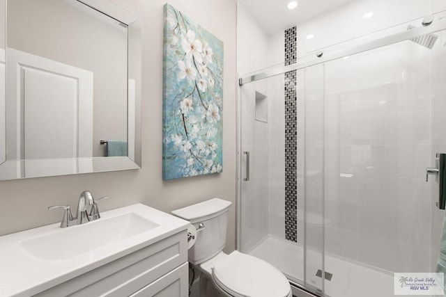 6121 Guadalupe River St, Brownsville, TX 78521 - full bathroom with toilet, a stall shower, vanity, and recessed lighting