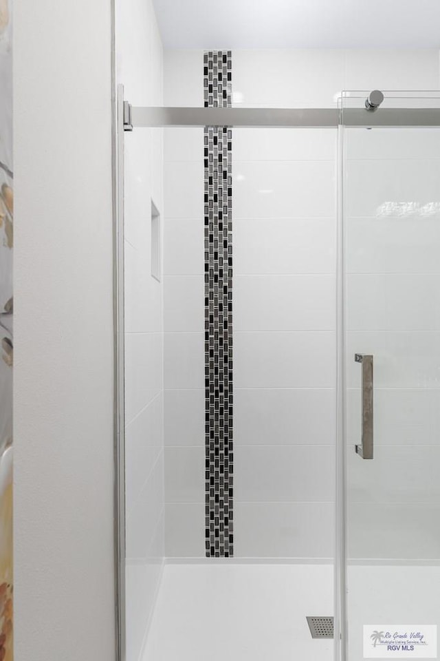 bathroom with an enclosed shower