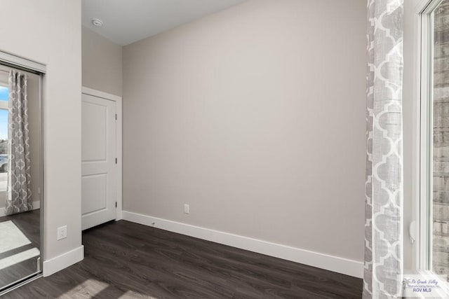 unfurnished bedroom featuring dark hardwood / wood-style floors