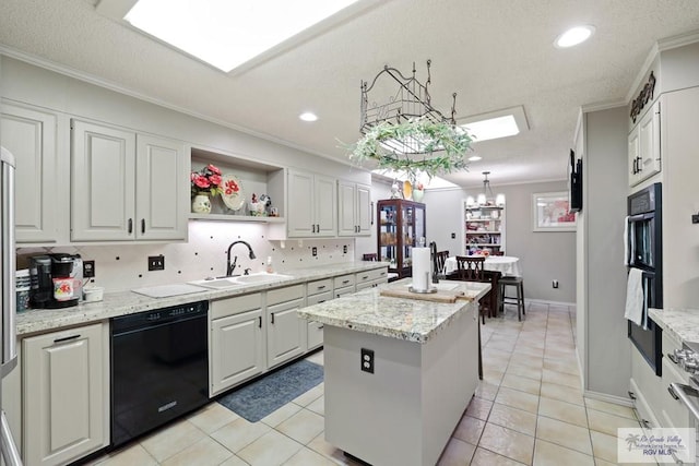 105 E Austin Ave, Harlingen, TX 78550 - kitchen featuring dishwasher, a sink, ornamental molding, a kitchen island, and white cabinets