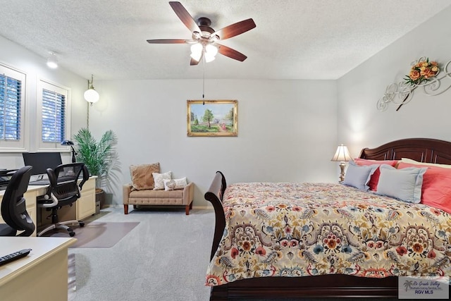 105 E Austin Ave, Harlingen, TX 78550 - bedroom featuring carpet flooring, a textured ceiling, an office area, ceiling fan, and baseboards