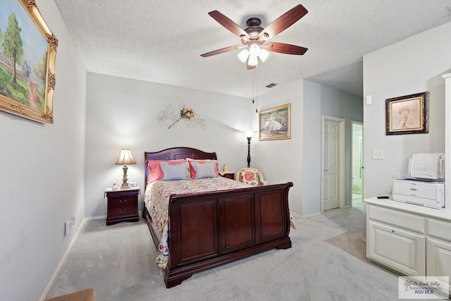 105 E Austin Ave, Harlingen, TX 78550 - bedroom featuring light colored carpet, baseboards, a textured ceiling, and ceiling fan
