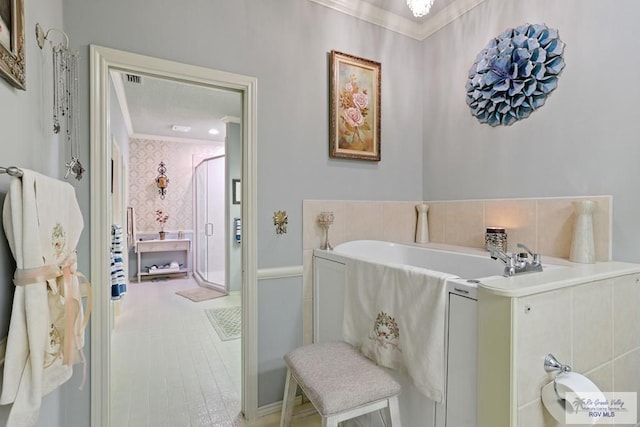 105 E Austin Ave, Harlingen, TX 78550 - full bathroom with crown molding, a bath, and a stall shower
