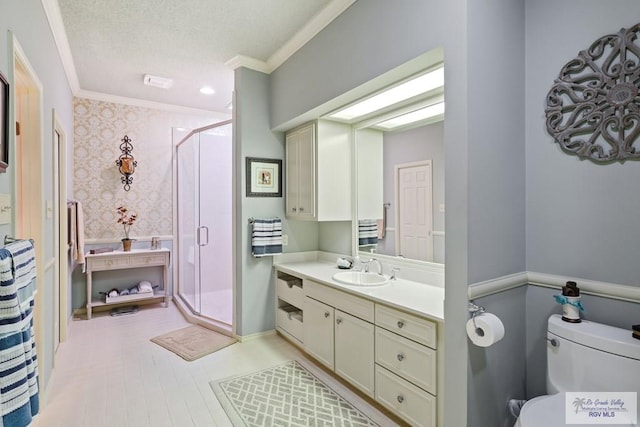 105 E Austin Ave, Harlingen, TX 78550 - bathroom featuring ornamental molding, vanity, a shower stall, wallpapered walls, and toilet