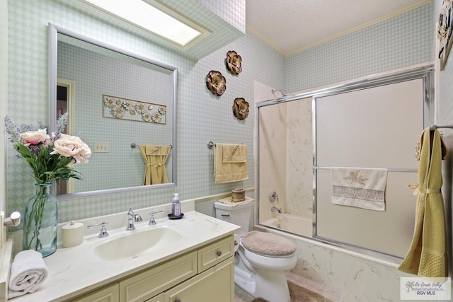 105 E Austin Ave, Harlingen, TX 78550 - bathroom featuring toilet, vanity, crown molding, bath / shower combo with glass door, and wallpapered walls