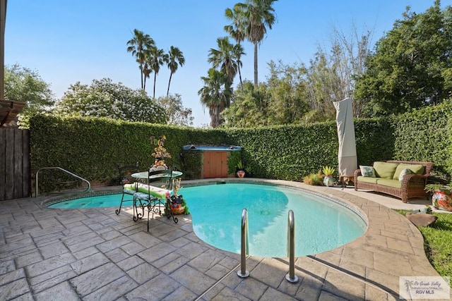 105 E Austin Ave, Harlingen, TX 78550 - view of swimming pool with a patio, a fenced backyard, and a hot tub