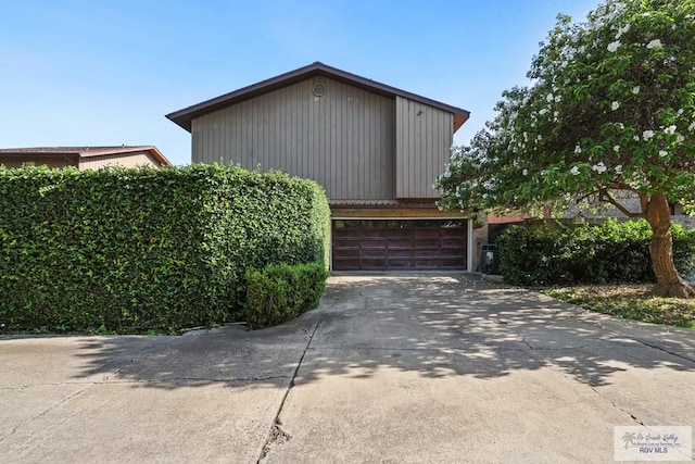 105 E Austin Ave, Harlingen, TX 78550 - view of side of property featuring a garage and driveway