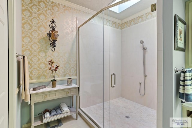 105 E Austin Ave, Harlingen, TX 78550 - bathroom featuring a shower stall, a skylight, wallpapered walls, and crown molding