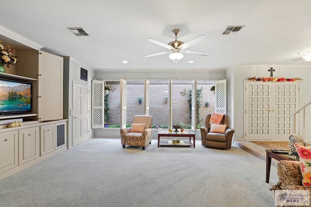 105 E Austin Ave, Harlingen, TX 78550 - living area with carpet floors, a ceiling fan, ornamental molding, and recessed lighting