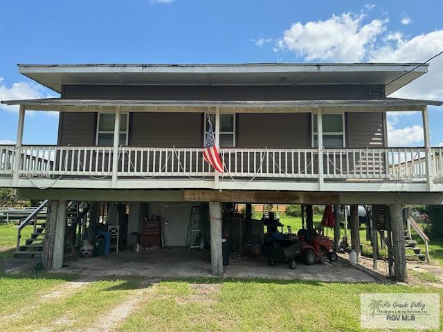 back of property featuring a porch