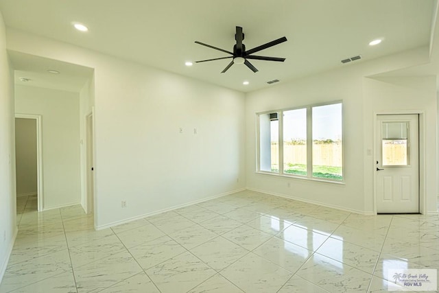 spare room with ceiling fan