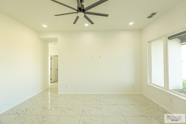 spare room featuring ceiling fan