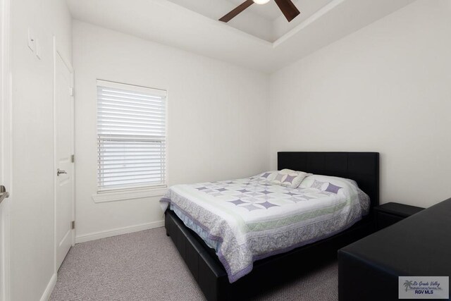 bedroom with ceiling fan and light colored carpet