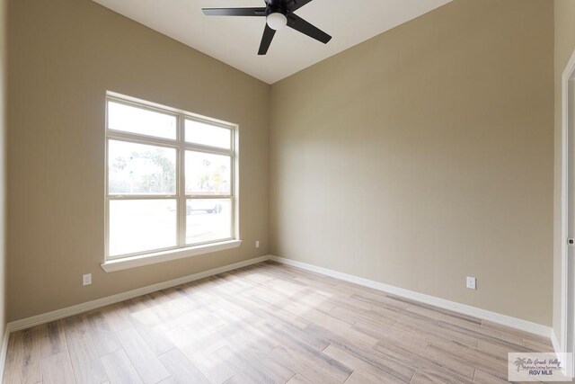 spare room featuring ceiling fan and light hardwood / wood-style floors