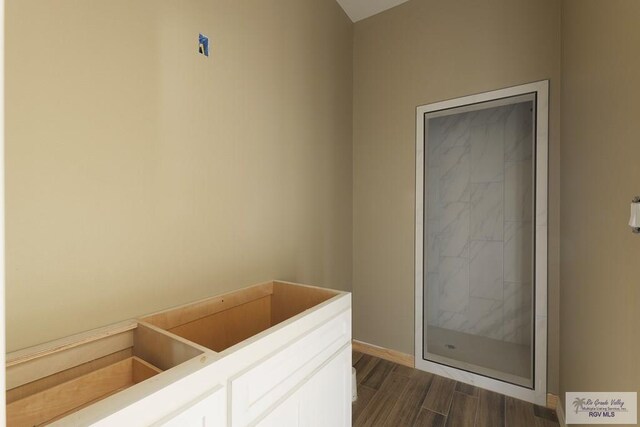 bathroom with hardwood / wood-style flooring