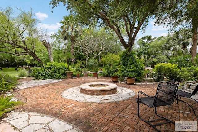 27603 Palo Verde Rd, San Benito, TX 78586 - view of patio / terrace with an outdoor fire pit