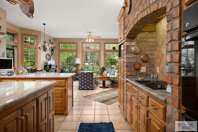 27603 Palo Verde Rd, San Benito, TX 78586 - kitchen with black appliances, plenty of natural light, open floor plan, and light tile patterned floors