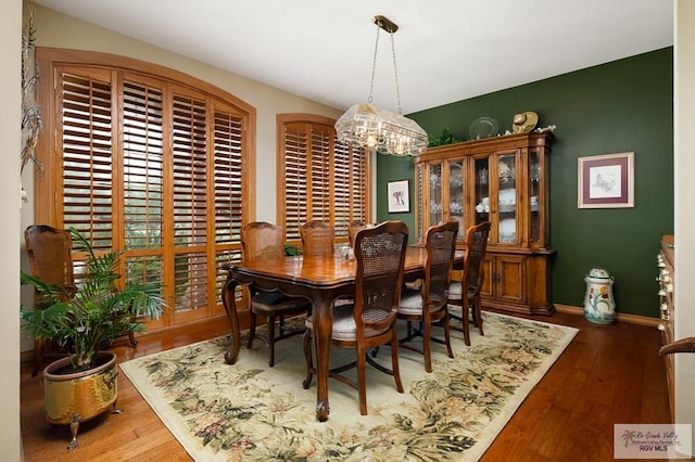 27603 Palo Verde Rd, San Benito, TX 78586 - dining space with a chandelier and wood finished floors