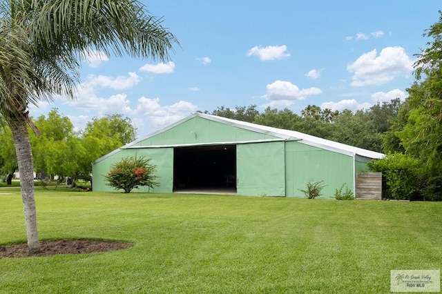 27603 Palo Verde Rd, San Benito, TX 78586 - view of pole building featuring a lawn