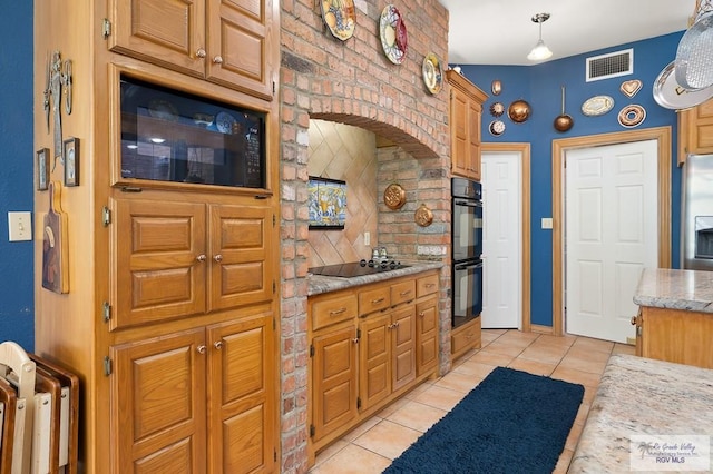 27603 Palo Verde Rd, San Benito, TX 78586 - kitchen with black appliances, light tile patterned floors, and light stone counters