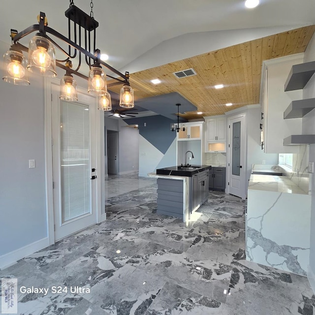 kitchen with recessed lighting, open shelves, white cabinets, visible vents, and open floor plan