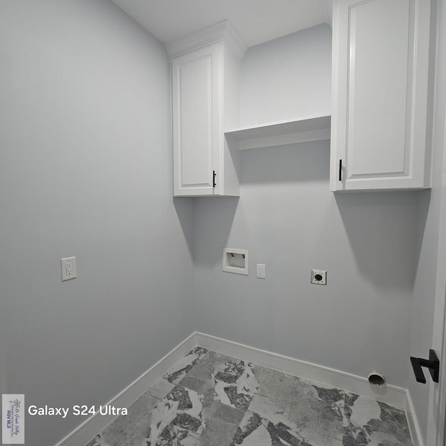 laundry room with electric dryer hookup, baseboards, hookup for a washing machine, cabinet space, and marble finish floor