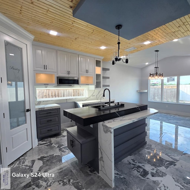 kitchen with wooden ceiling, stainless steel microwave, a chandelier, open shelves, and a sink