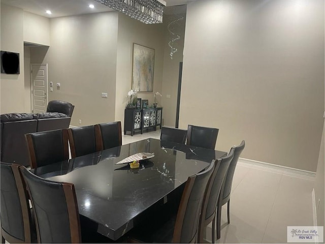 dining space featuring recessed lighting, baseboards, and light tile patterned floors