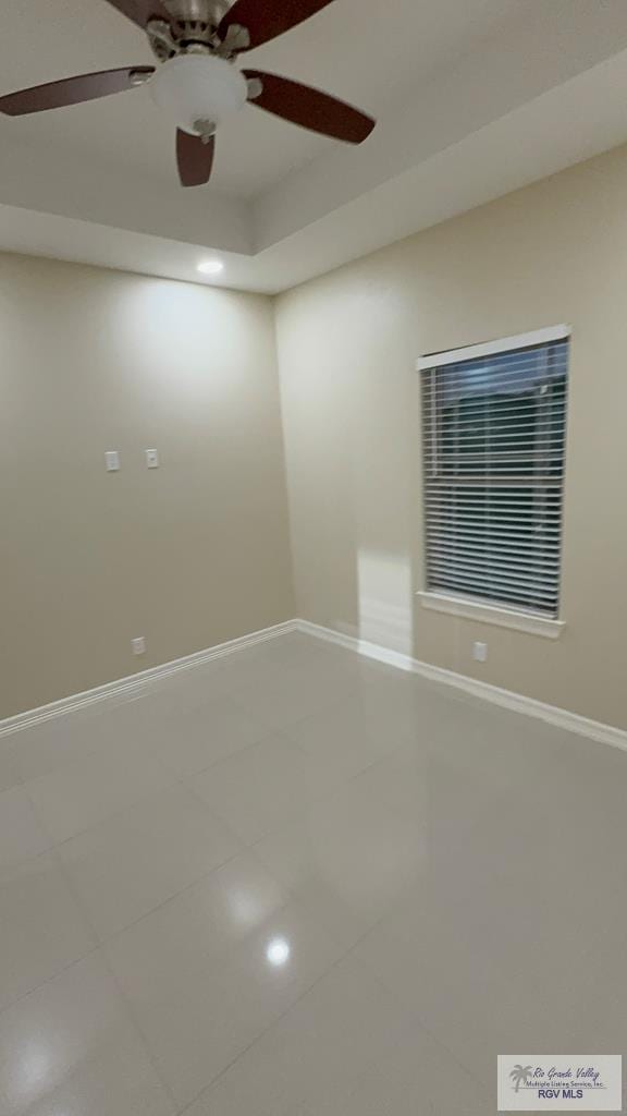 tiled empty room with baseboards