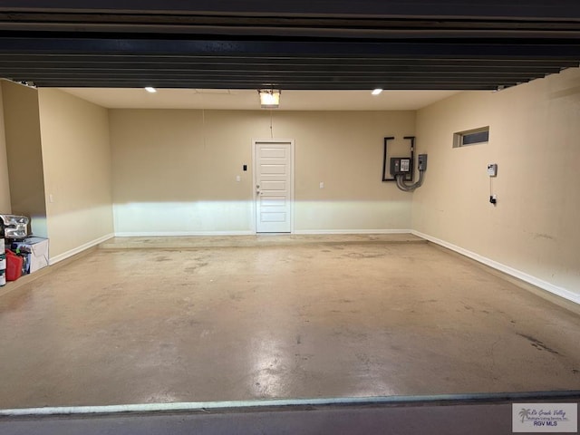 garage featuring baseboards and a garage door opener