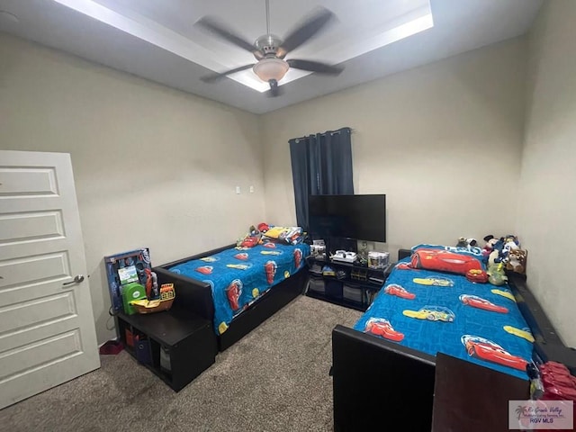 carpeted bedroom featuring a ceiling fan