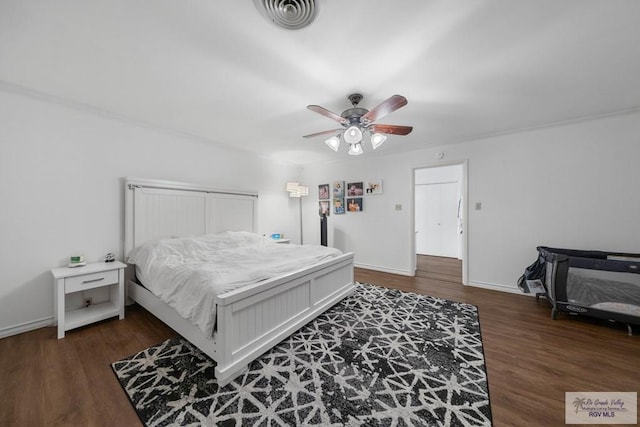 bedroom featuring ceiling fan and dark hardwood / wood-style floors