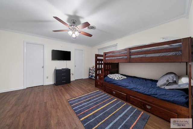 unfurnished bedroom with ceiling fan, dark hardwood / wood-style flooring, and ornamental molding