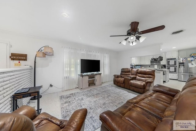 living room with ceiling fan