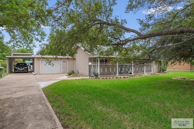 single story home with covered porch, a carport, a garage, and a front lawn